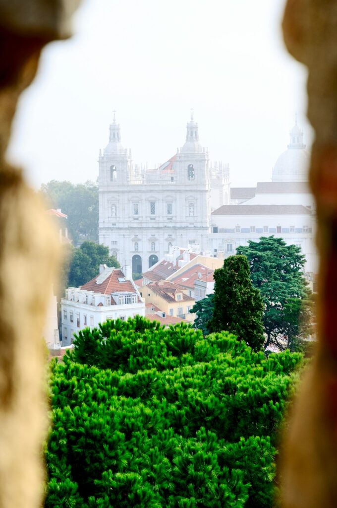 Viewing Lisbon's modern architecture from a gap in the old castle. Lisbon city, Portugal, Europe